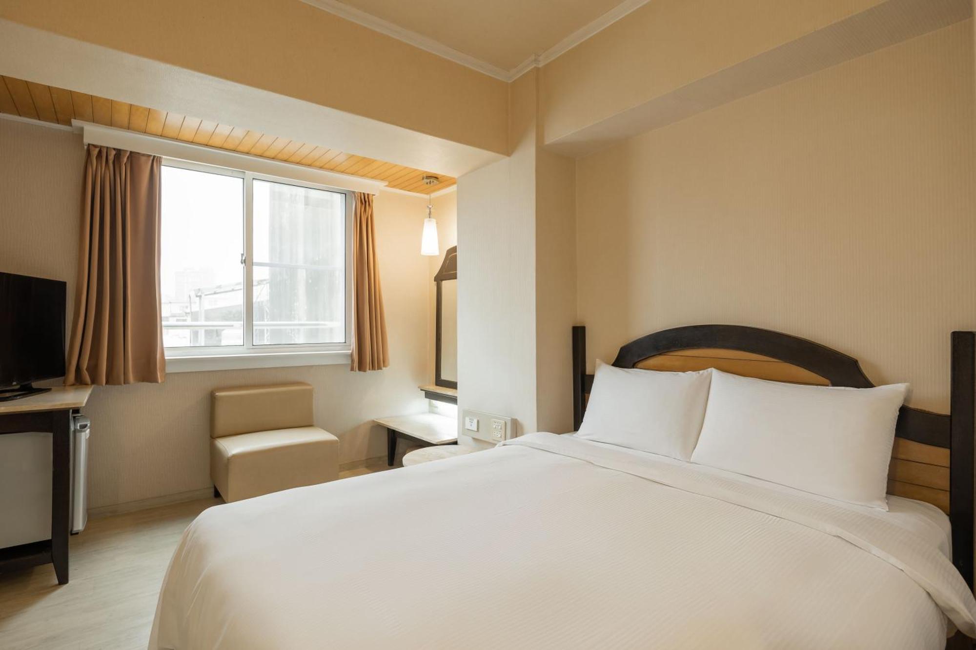 Kindness Hotel Weiwuying Каосюн Стая снимка